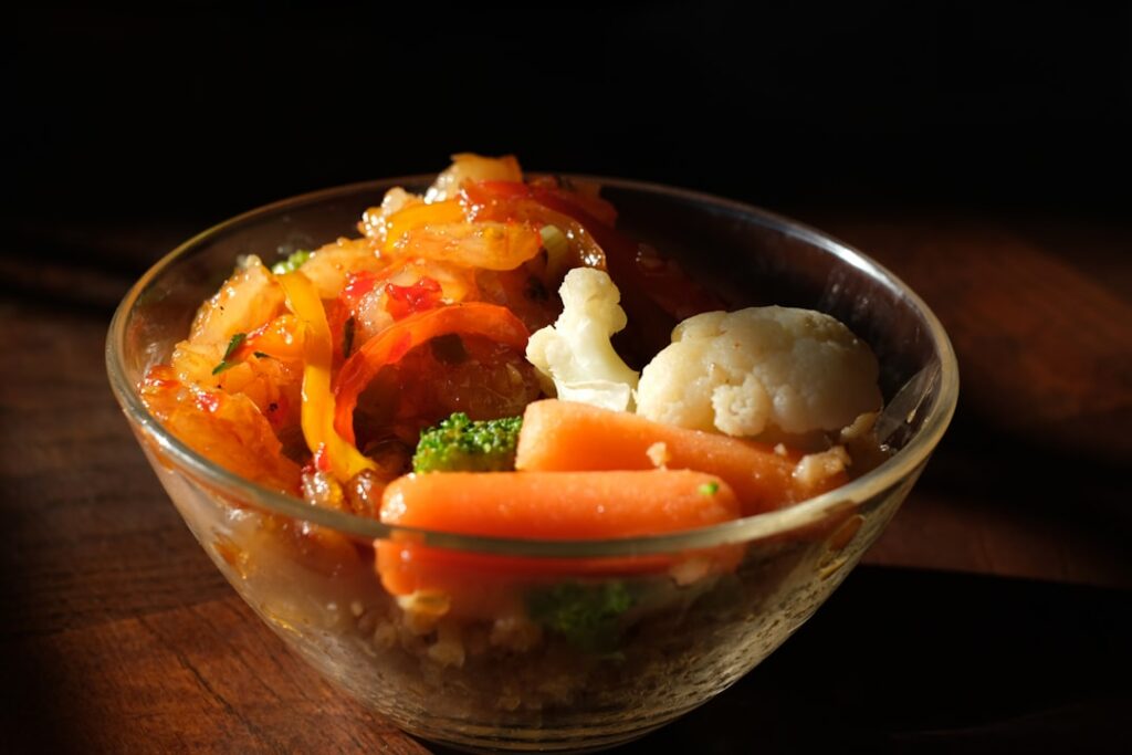 A close-up of a beautifully composed quinoa and roasted vegetable bowl featuring vibrant colors and a healthy inviting a