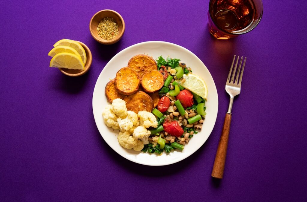 A vibrant overhead shot of a beautifully arranged single plate of healthy whole foods similar to the right side of the c