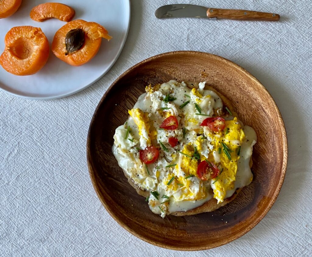 An inviting close-up image of a bowl of Savory Tahini Everything Bagel Oats The creamy oats are topped with a perfectly 