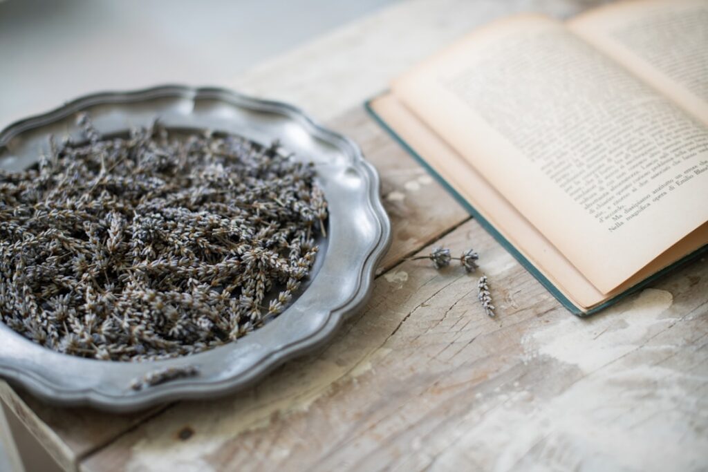 Close-up of dried culinary lavender buds in a small wooden bowl