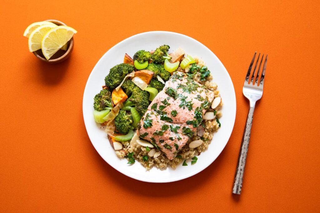A vibrant well-balanced meal featuring a variety of high-protein foods including both animal-based e g lean chicken eggs