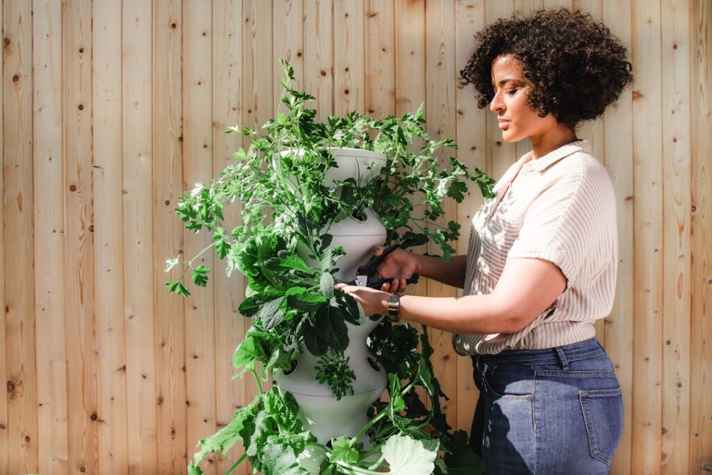 An inspiring vertical garden setup with various plants growing upwards on a wall showcasing different techniques like st