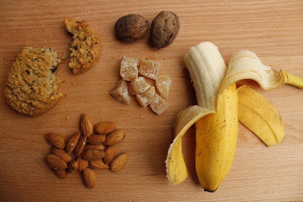 A vibrant flat lay of various magnesium-rich foods including leafy greens nuts seeds dark chocolate and fish