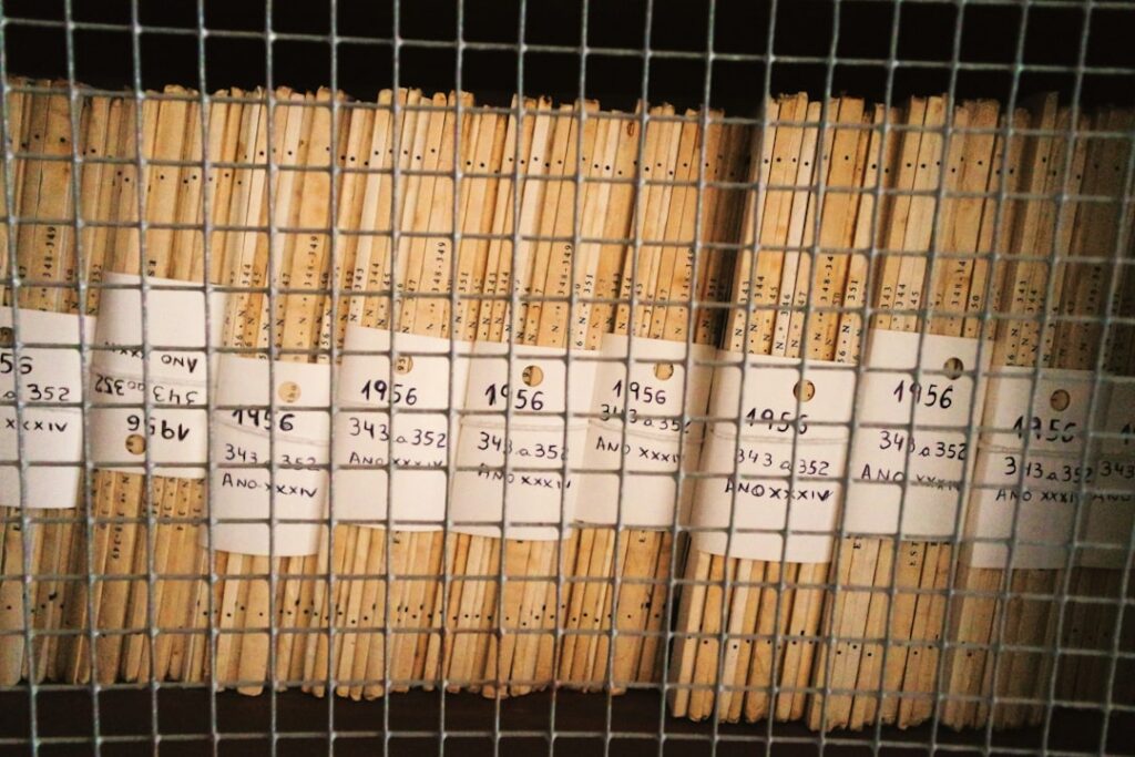 A close-up shot of a variety of homemade wafer sticks in different flavors arranged neatly on a cooling rack or in a gla