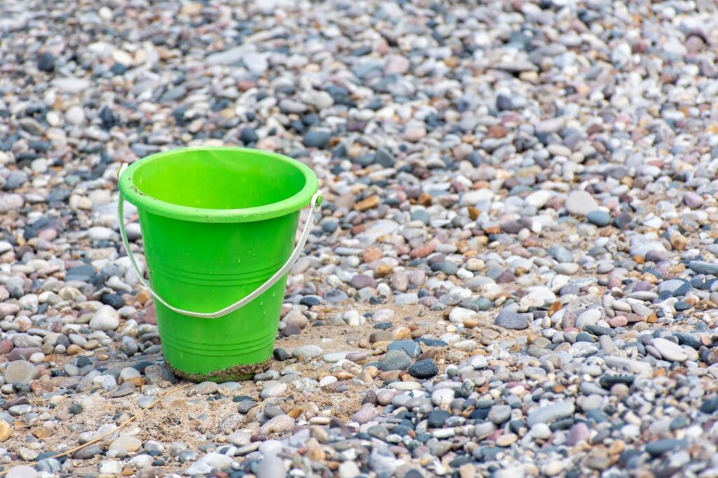 An illustration of a classic Which Bucket Fills First logic puzzle showing several interconnected buckets with tubes and