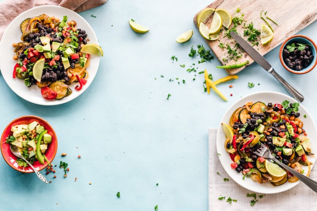 A variety of kidney-friendly iron-rich foods laid out beautifully on a table such as lean chicken fortified cereal spina