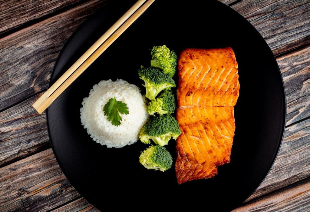 A vibrant plate featuring grilled salmon a side of quinoa and steamed broccoli showcasing a healthy and balanced meal