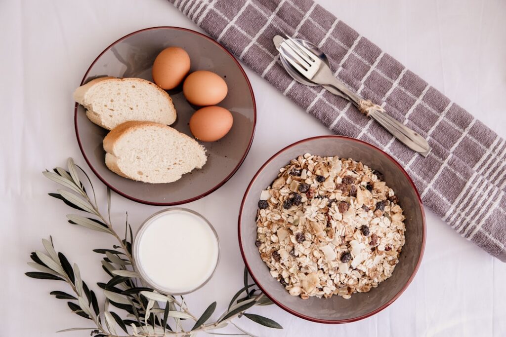 A vibrant well-arranged flat lay of various high-protein foods including chicken breast salmon eggs Greek yogurt lentils