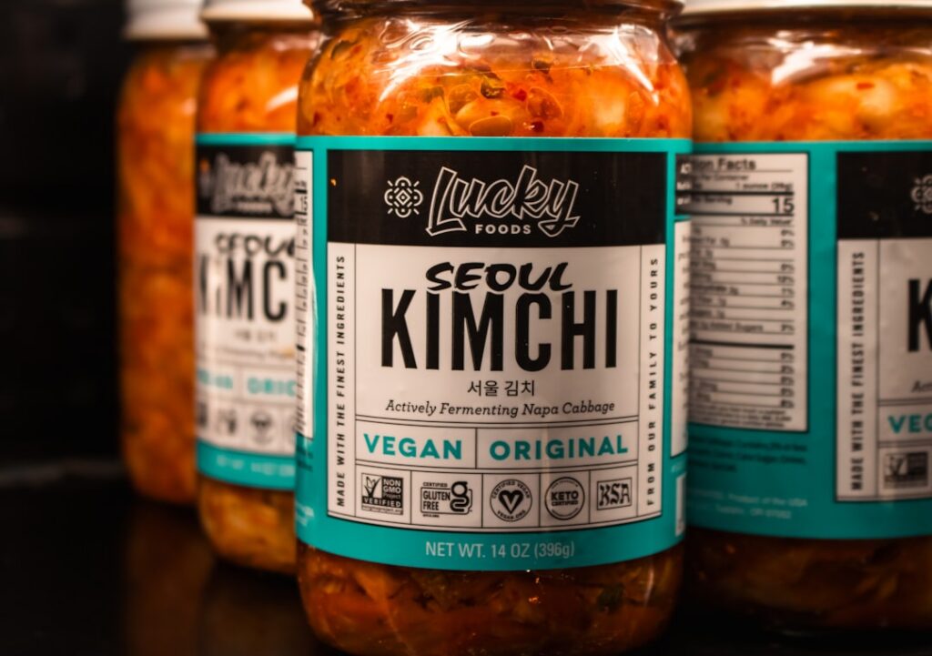 A bowl of colorful kimchi with chopsticks symbolizing probiotic-rich foods for gut health