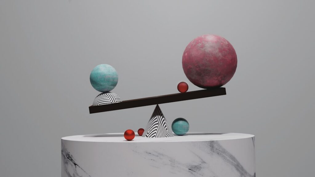 An illustration of a perfectly balanced scale On the left pan there are six identical blue balls and a cube-shaped weigh