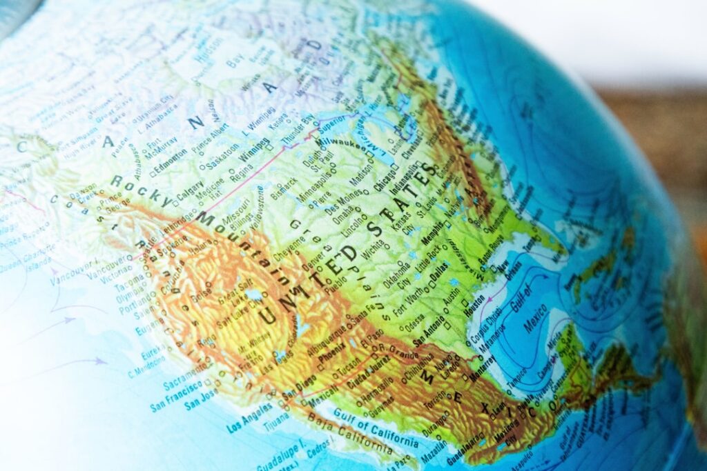 A colorful map of the United States with California prominently highlighted or glowing symbolizing its significant econo