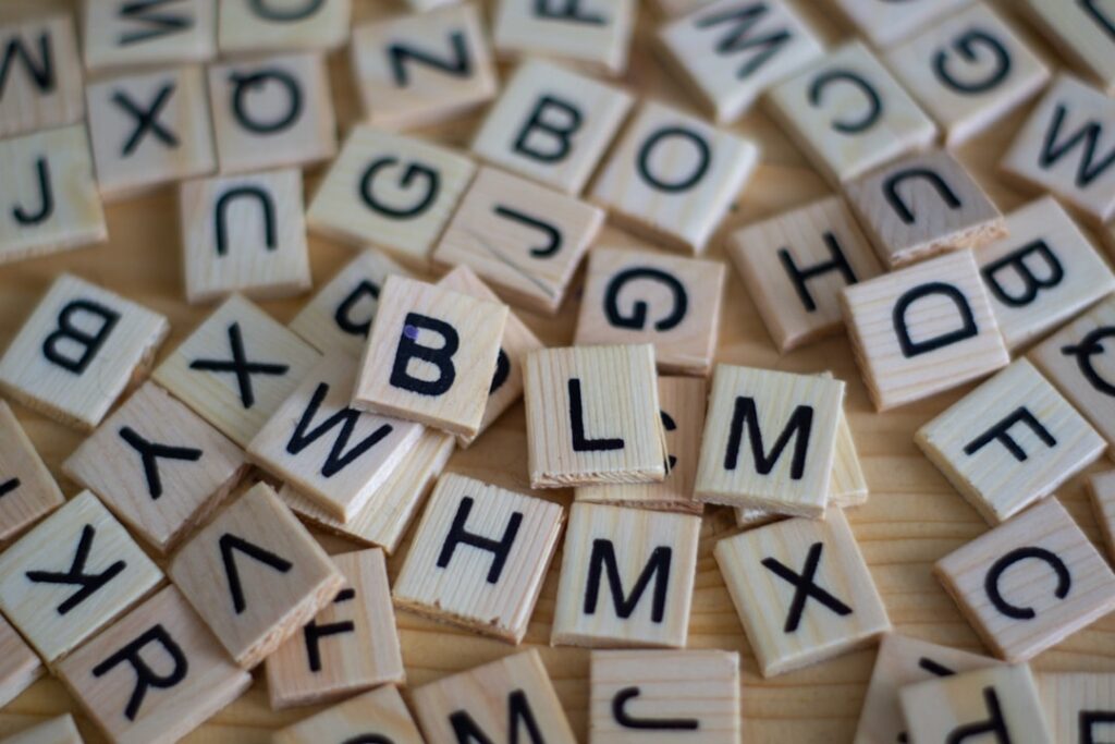 A visual representation of the word puzzle featuring the jumbled letters L O M R A prominently displayed in a fun engagi