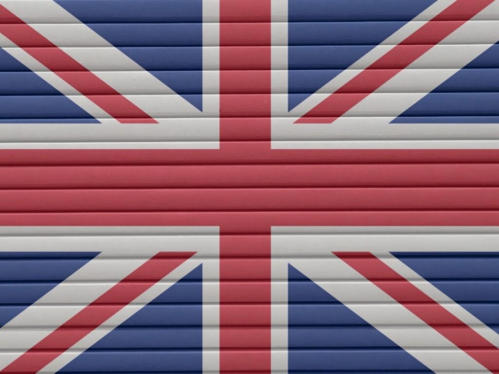 A visual rebus puzzle displaying praying hands next to the flag of the United Kingdom