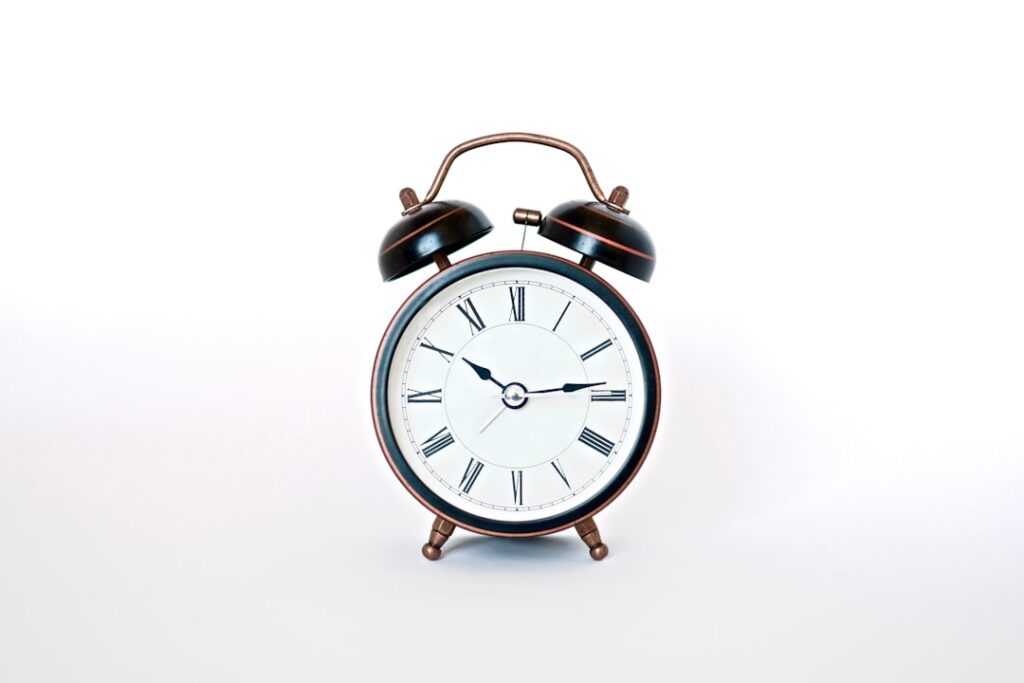 An antique clock face with hands pointing to 11 and 1 visually representing the time riddle There s a subtle blur or dre