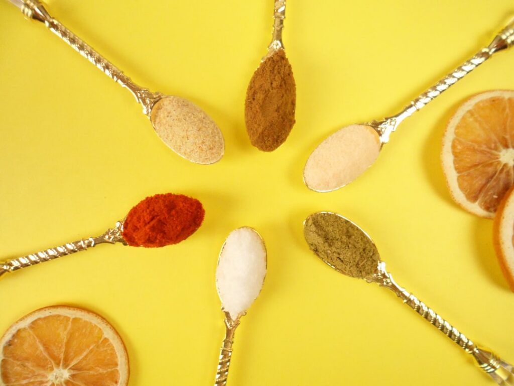 An aesthetic flat lay of various natural sweeteners in small attractive bowls or jars Include items like honey maple syr