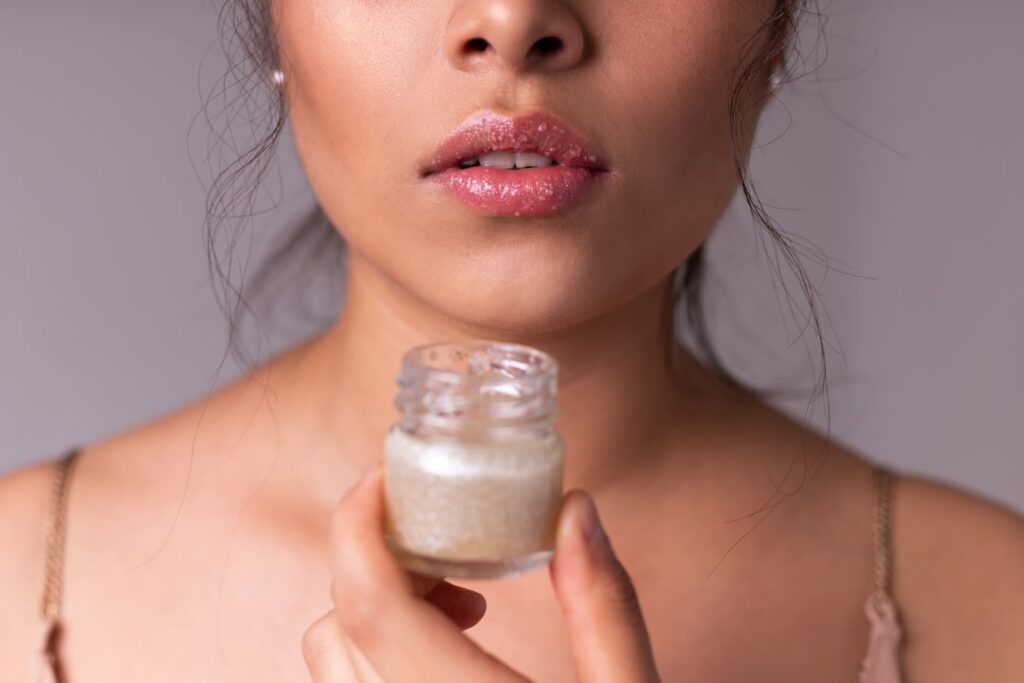 A close-up of a person gently applying a clear soothing gel to their face with a soft healthy glow on their skin Fresh o