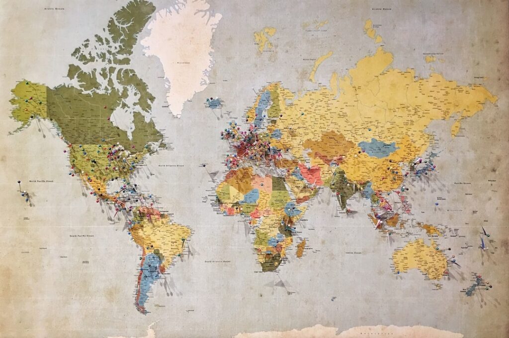 A world map with continents clearly outlined and labeled highlighting the four answer choices Asia Africa North America 