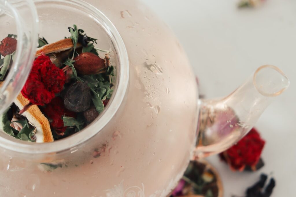 A vibrant aesthetically pleasing collection of gut-friendly drinks like fruit-infused water a green smoothie and a cup o