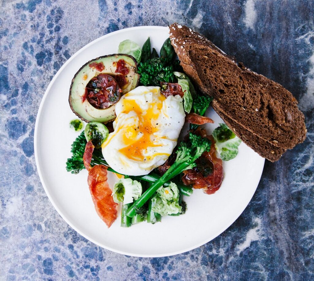 A variety of healthy balanced breakfast plates featuring eggs prepared in different ways scrambled poached boiled alongs