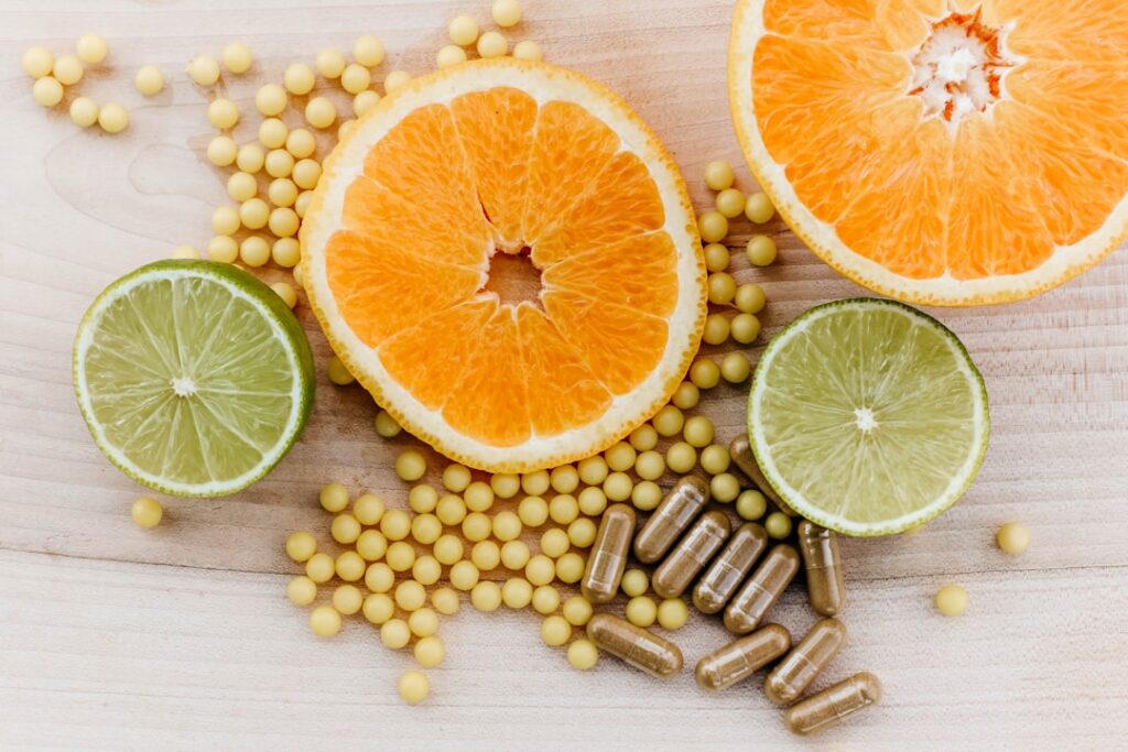 A vibrant mix of fruits and vegetables rich in Vitamin C such as oranges bell peppers strawberries kiwi and broccoli arr