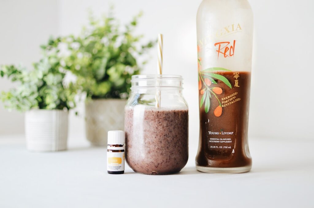 A beautiful glass of a natural homemade collagen tonic perhaps with some fruit slices or herbs for garnish set against a