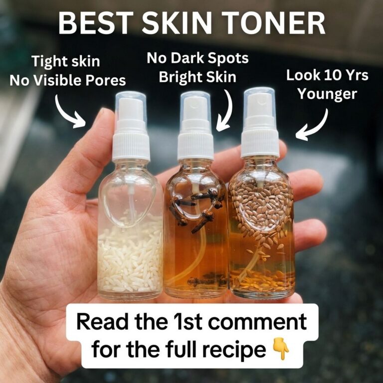 A hand holding three small clear spray bottles each containing natural ingredients like white rice dark cloves and light