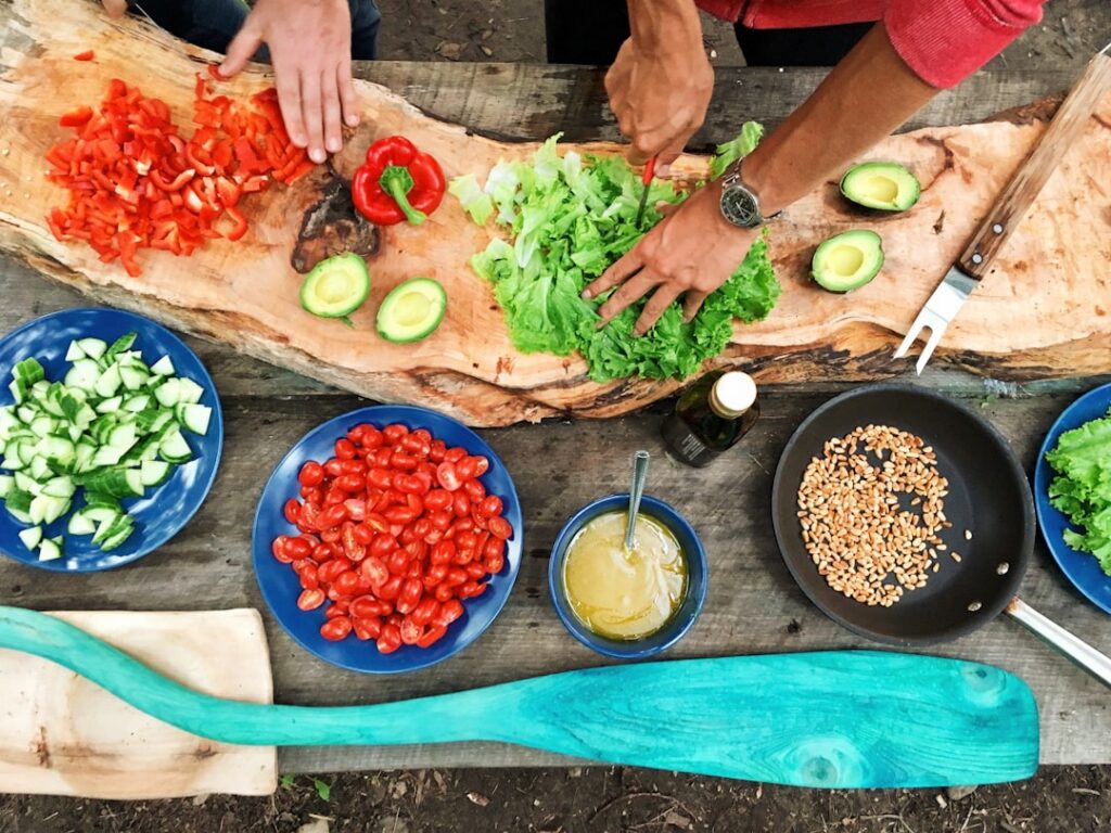 A person s hands preparing a healthy salad with fresh vegetables showing the act of mindful cooking and eating