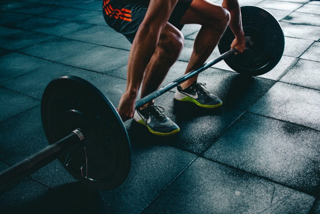 A person performing a barbell squat with good form demonstrating proper technique and muscle engagement