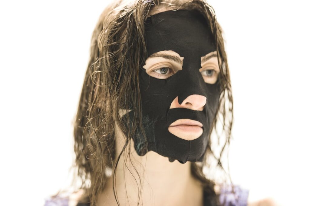 A woman smiling with clear radiant skin highlighting the after effect of a glow-boosting beauty routine