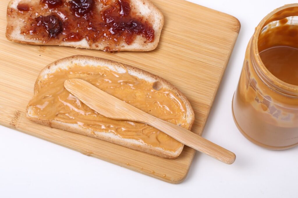A vibrant and healthy spread of foods known to lower cholesterol including a bowl of soy milk cooked barley sliced eggpl