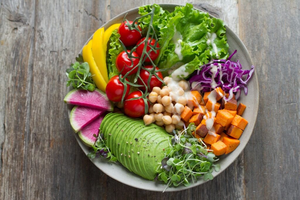 A balanced plate featuring a healthy meal that incorporates several fertility-boosting ingredients such as grilled salmo