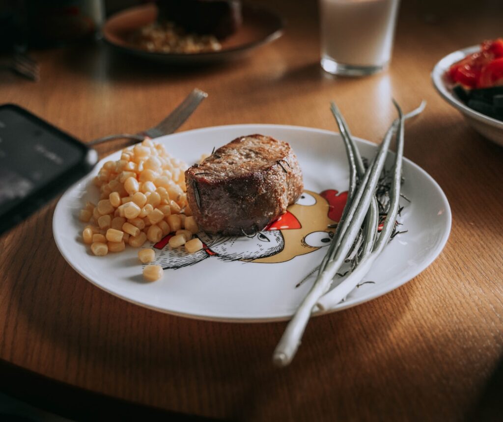 A balanced plate featuring a mix of lean beef red kidney beans and colorful vegetables demonstrating diverse dietary cho