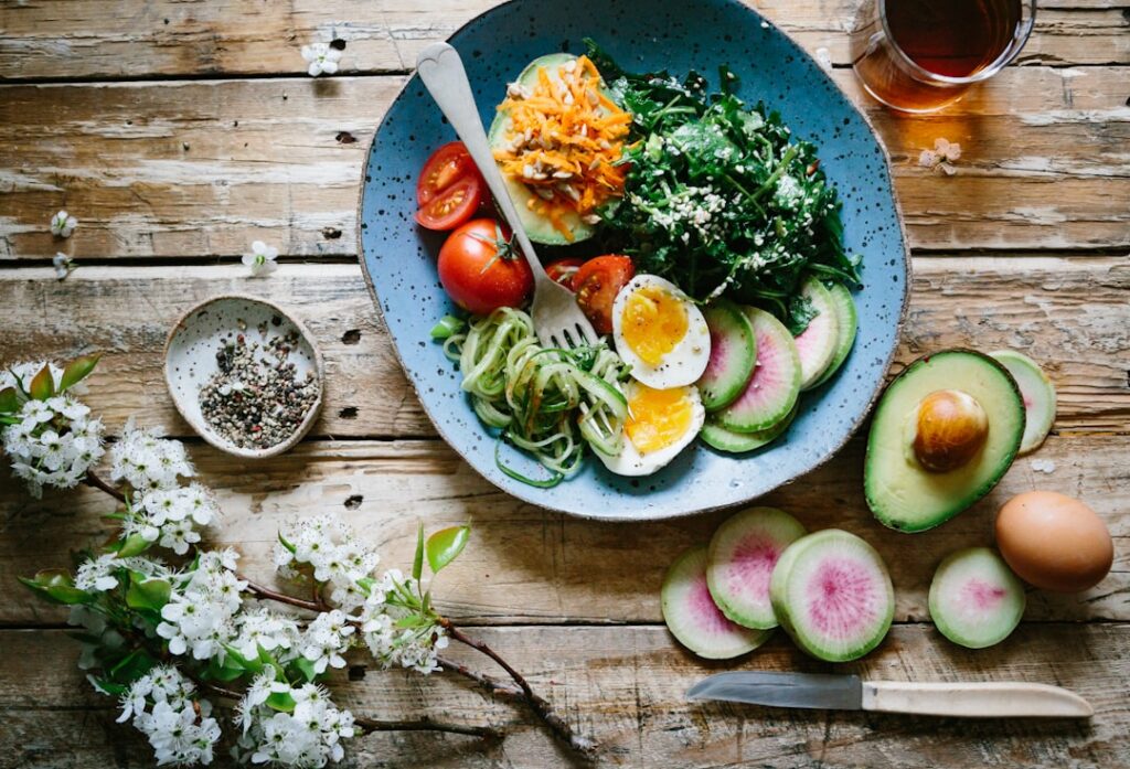 A balanced portion-controlled meal on a plate featuring lean protein whole grains and a generous serving of vegetables i