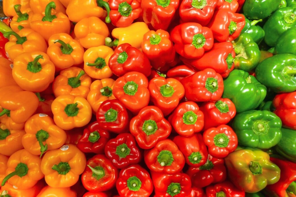A vibrant assortment of different types and colors of chili peppers showcasing diversity