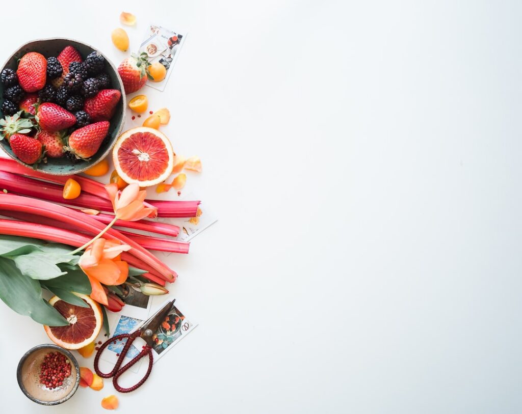 A vibrant collage of fresh foods known to help reduce water retention including cucumber watermelon slices bananas avoca