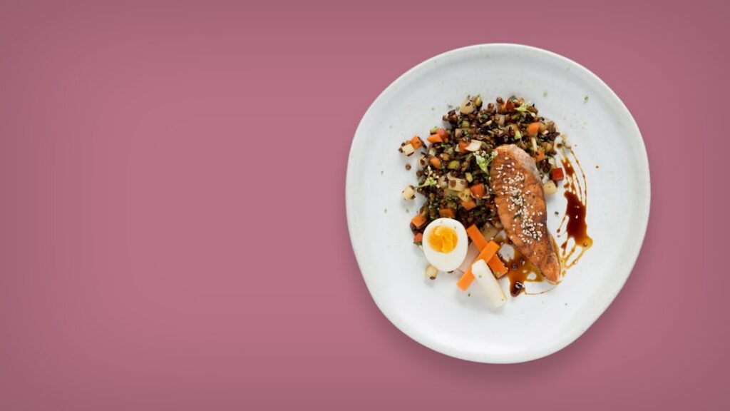 Various animal protein sources like chicken fish and eggs on a plate