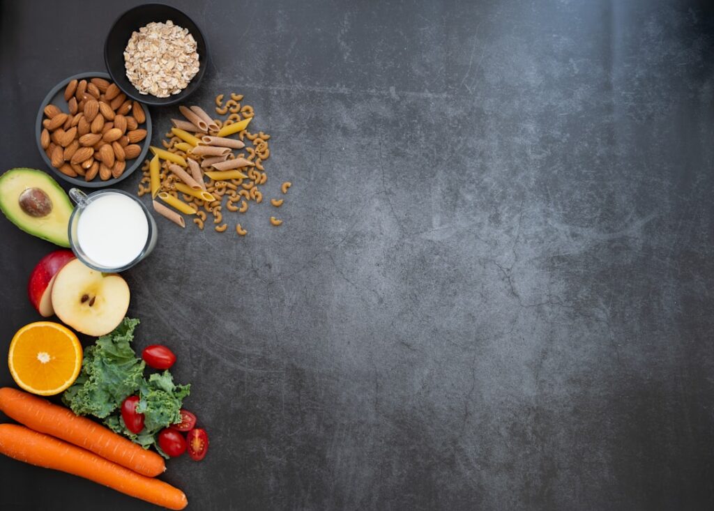 A vibrant flat lay of various zinc-rich foods like pumpkin seeds lentils chickpeas nuts and whole grains arranged aesthe