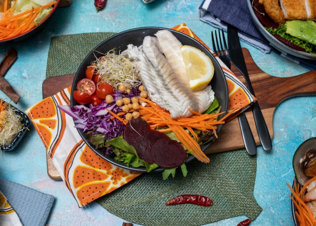 A vibrant colorful bowl or plate overflowing with various protein-rich vegetables such as green peas spinach broccoli fl