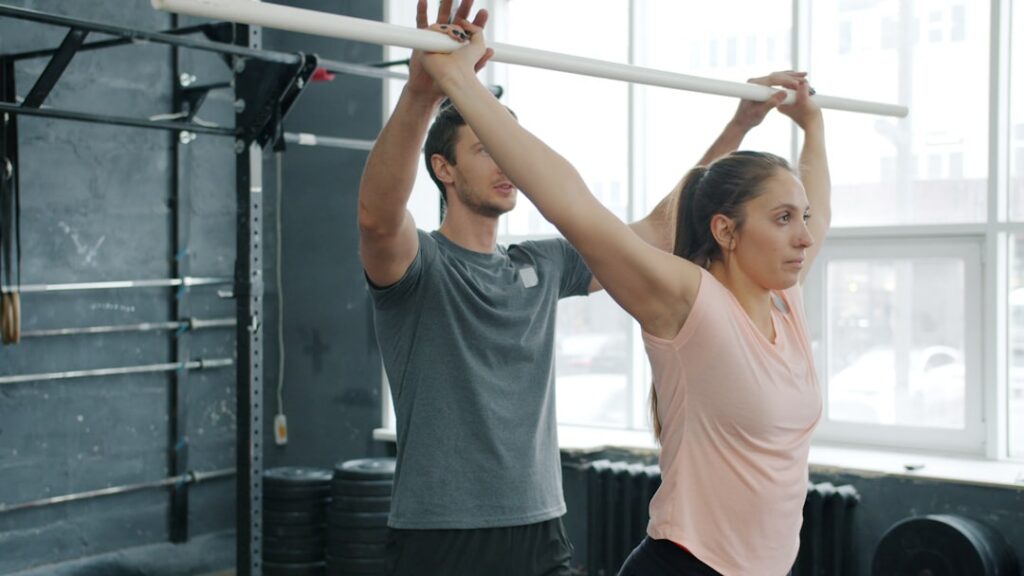 An athlete performing wide-grip pull-ups with excellent form focusing on back muscle engagement