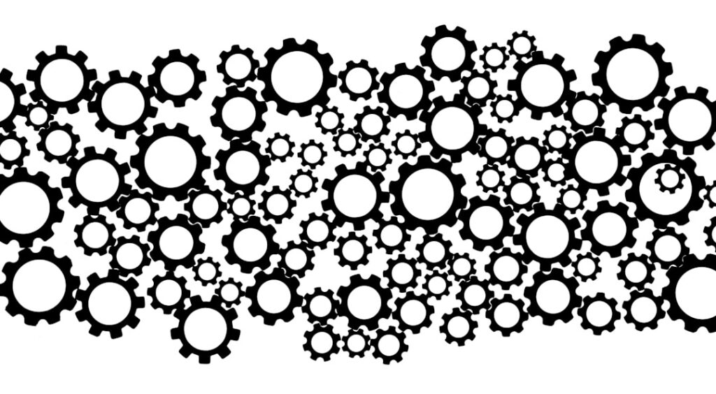 A vibrant image showing a brain made of gears or puzzle pieces surrounded by mathematical symbols and question marks sym