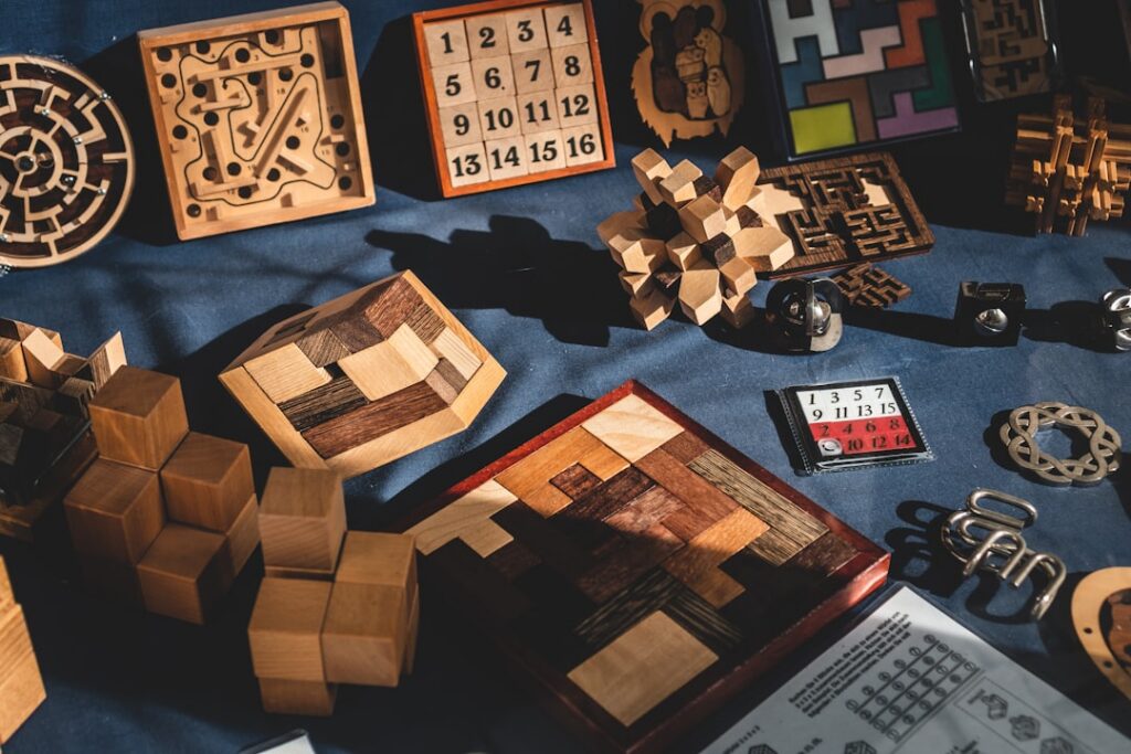 A visual representation of the number puzzle with the numbers 2 3 5 7 9 10 11 13 15 17 displayed on individual wooden ci