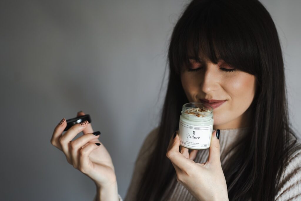 A woman gently applying a small amount of face balm to her cheek demonstrating the proper use of the DIY Vaseline mixtur
