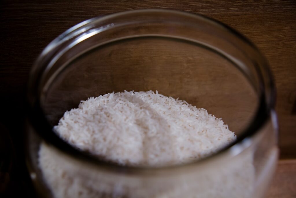 A small glass jar filled with the homemade vaseline rice and clove glass skin balm
