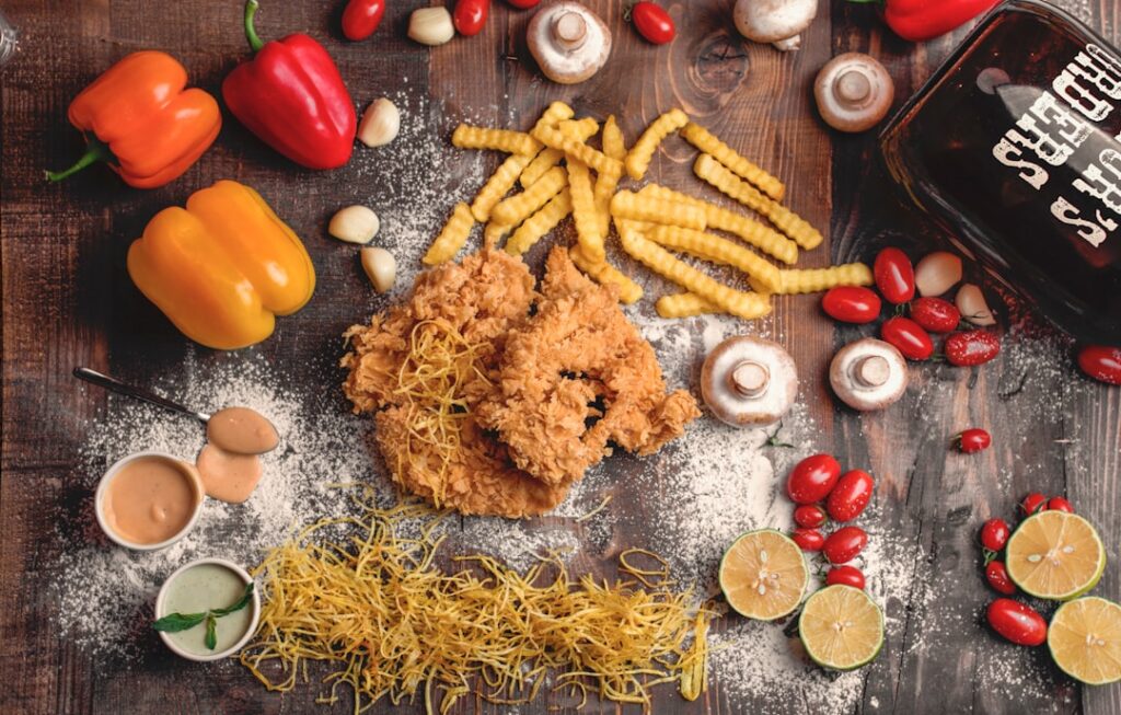 A bowl of golden crispy vegan fried chicken pieces e g tofu or seitan coated in a seasoned flour mix with a sprinkle of 
