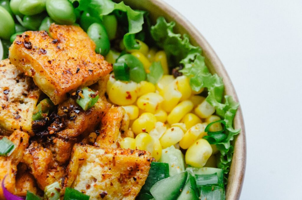 An array of diverse plant-based proteins like tofu tempeh seitan lentils and chickpeas highlighting their unique texture