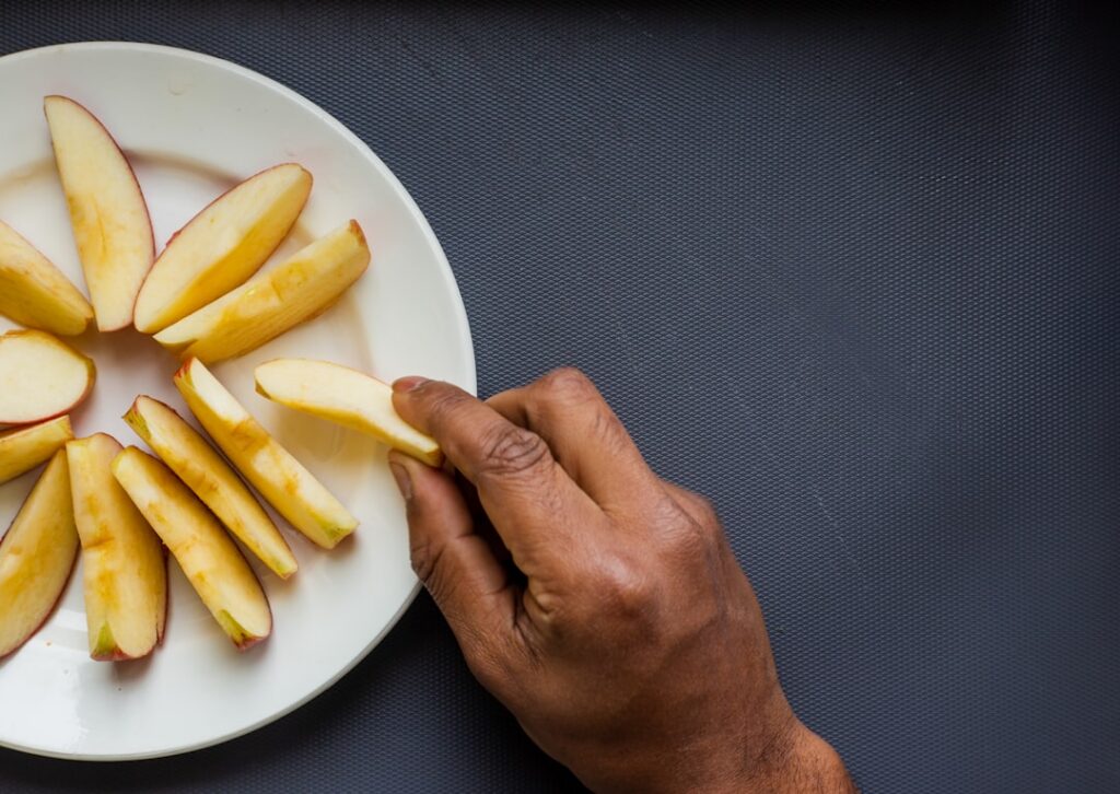 An infographic or visual guide showing different hand shapes palm fist cupped hand thumb next to examples of food items 