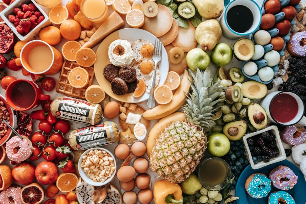 A colorful array of various energy-boosting foods including oats berries nuts leafy greens eggs and avocados artfully ar