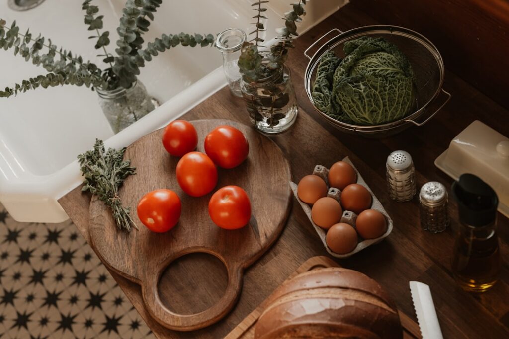 A variety of healthy food swaps laid out on a kitchen counter for example brown rice next to white rice a bowl of lentil