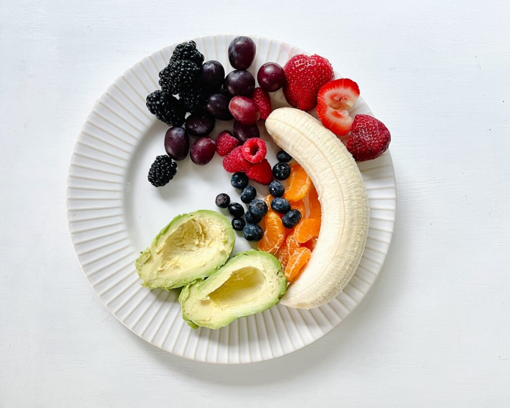 A vibrant array of diverse whole foods including colorful fruits vegetables whole grains and lean proteins arranged appe