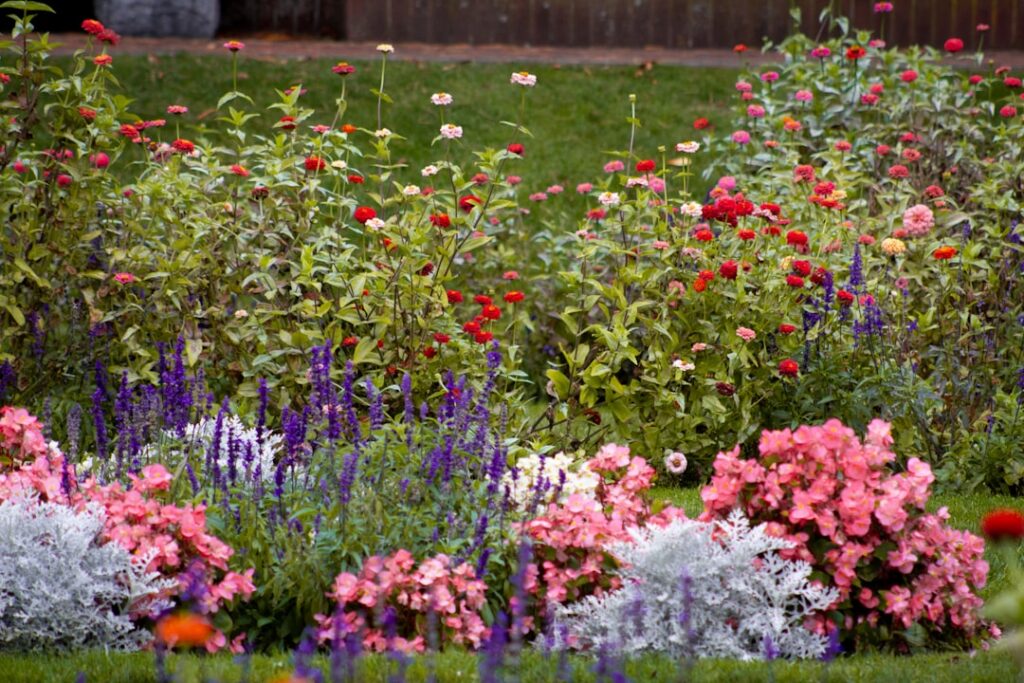 A vibrant diverse garden with various pest-deterring plants like marigolds nasturtiums and herbs interspersed among vege